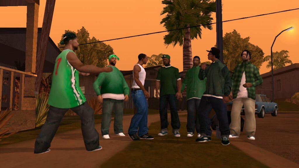 Cena de um jogo de mundo aberto mostrando um personagem diante de um grupo de moradores em um bairro residencial durante o pôr do sol. O ambiente urbano, inspirado em comunidades norte-americanas, destaca ruas, casas, palmeiras e veículos estacionados, transmitindo uma atmosfera típica de jogos focados em exploração, narrativa e interação com diferentes personagens ao longo da aventura