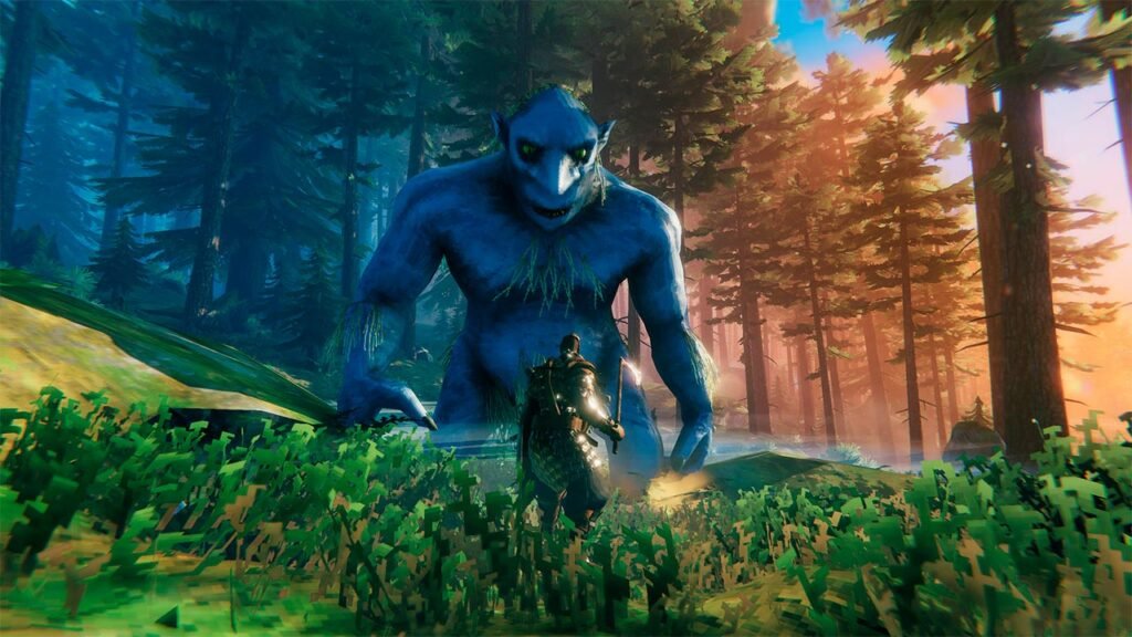 A imagem mostra um guerreiro enfrentando uma gigantesca criatura azul em uma floresta densa durante o pôr do sol. O cenário combina vegetação exuberante, iluminação cinematográfica e uma atmosfera de fantasia, transmitindo a sensação de um confronto épico onde o jogador precisa usar estratégia e coragem para sobreviver diante de um inimigo colossal